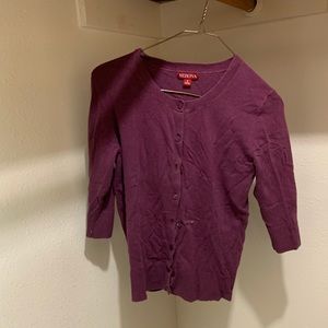 Purple button-up sweater.
